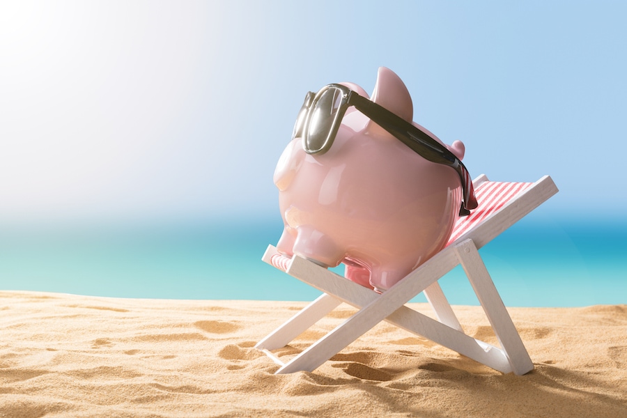 Close-up Of A Pink Piggy Bank Wearing Sunglasses Relaxing On Deck Chair, Spring Money-Saving Tips | Air Conditioner, Ductless AC | Repair, Service