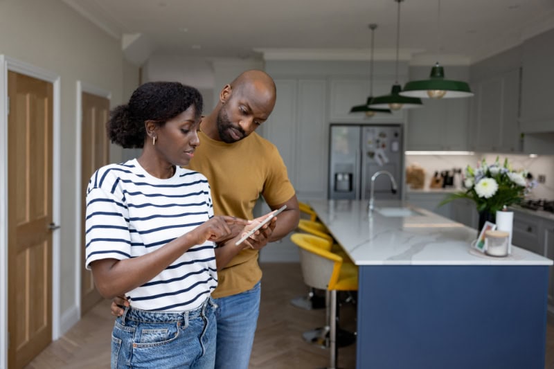 Couple looking at paperwork.
